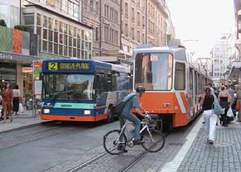 Modern trolleybus in Geneva, Switzerland sharing the pedestrian zone with the trams.