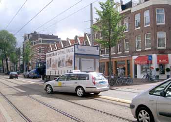 Vehicles briefly straying on to light rail reserved right of way in Amsterdam.