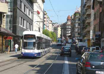 Vehicles briefly straying on to light rail reserved right of way in Geneva.