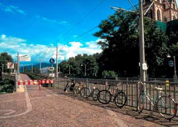 Light rail right of way flanked by pedestrian and cycle paths.