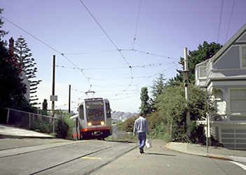 Arriving at summit of sharply graded incline.