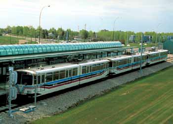 Triple unit light rail service on a off-street private right of way.