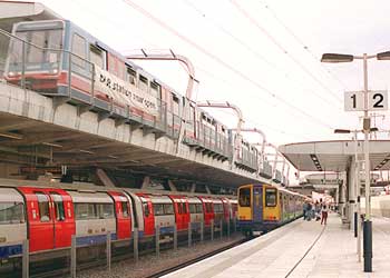 Various electric railways at Canning Town station in London. Top; Docklands Light Railway (light rail); Below: Jubilee Line (heavy rail - city specific underground / metro / subway). Right; North London Line (heavy rail - national mainline / urban).