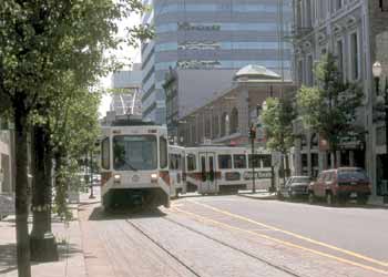 A two-car unit turning a city street corner.