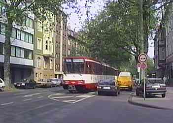 Cars waiting for LRV to pass so that they can use the reserved right of way to pass an illegally parked van.