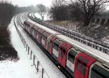 tube train electric rail snow sparks.